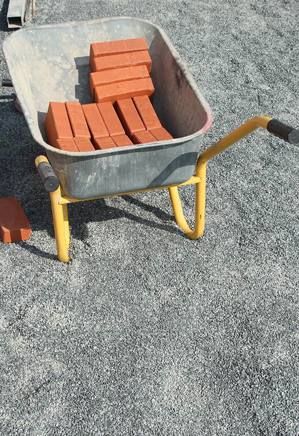 Wheelbarrow With Red Bricks — Wheelbarrows in Yeppoon, QLD