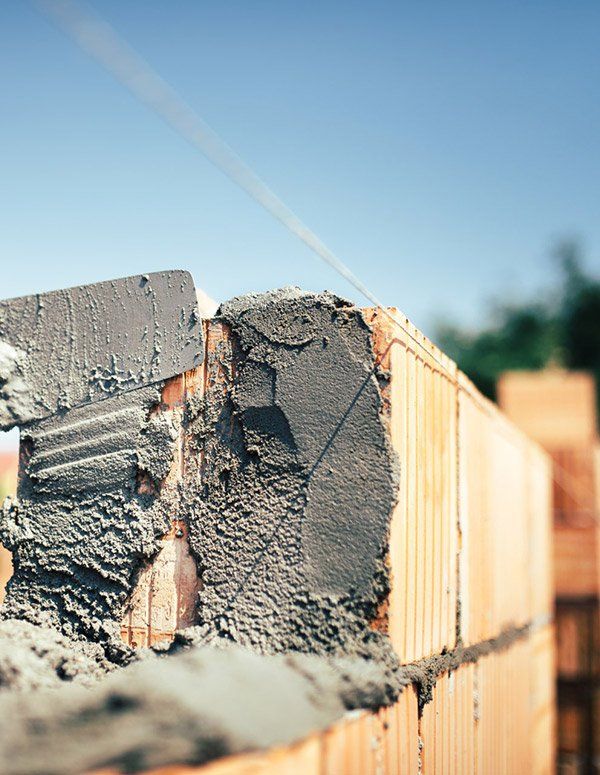 Installing Brick Masonry On Exterior Wall — New Home Builds in Yeppoon, QLD