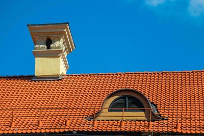 Waterproof Chimney — Building Roof Covered with Red Tiles in Orlando, FL Waterproof Chimney — Building Roof Covered with Red Tiles in Orlando, FL