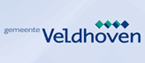 Het logo van de gemeente Veldhoven in blauw en groen op een witte achtergrond.