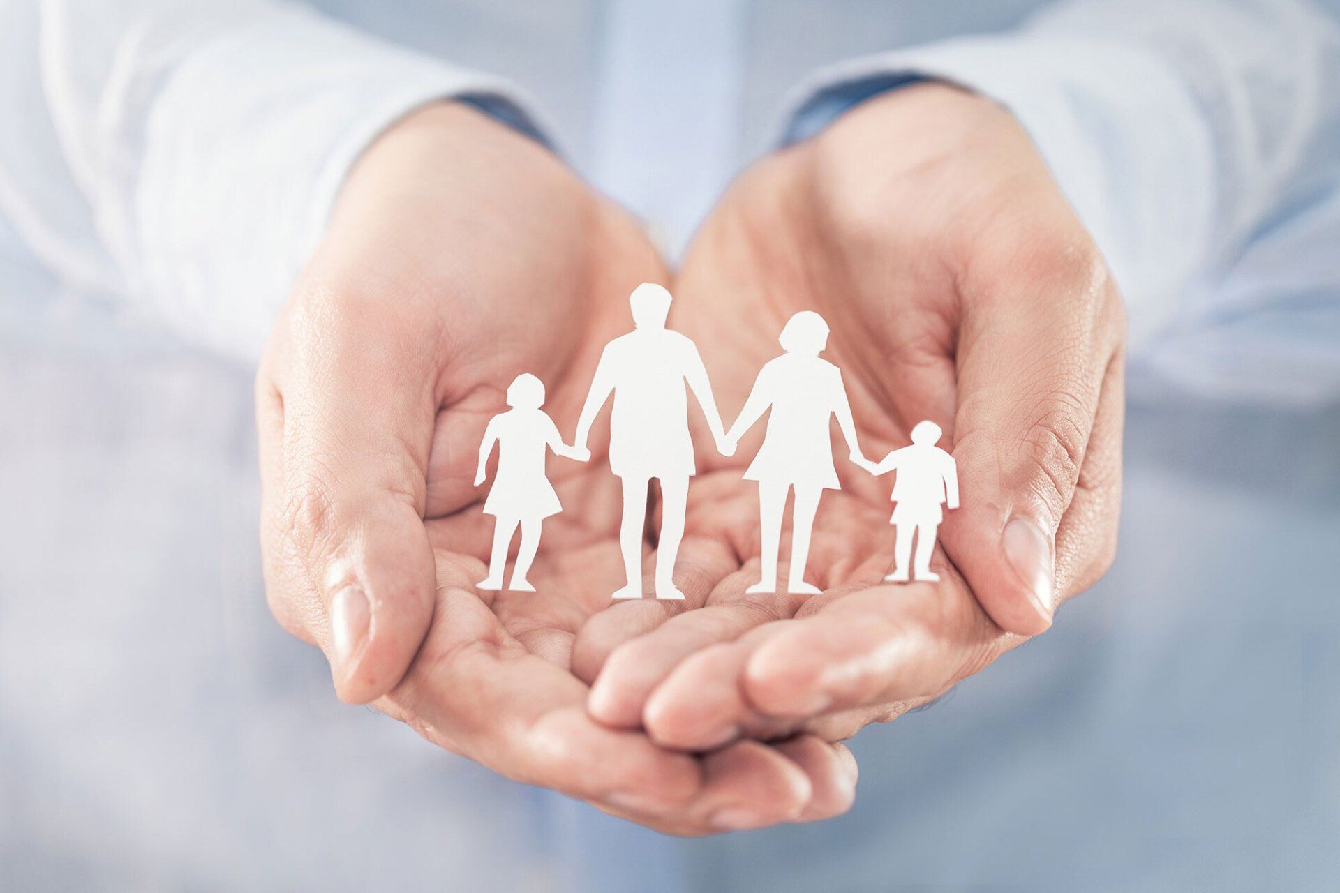Hands with Cut Out Paper — Saint Joseph, MI — Metzger Insurance Agency