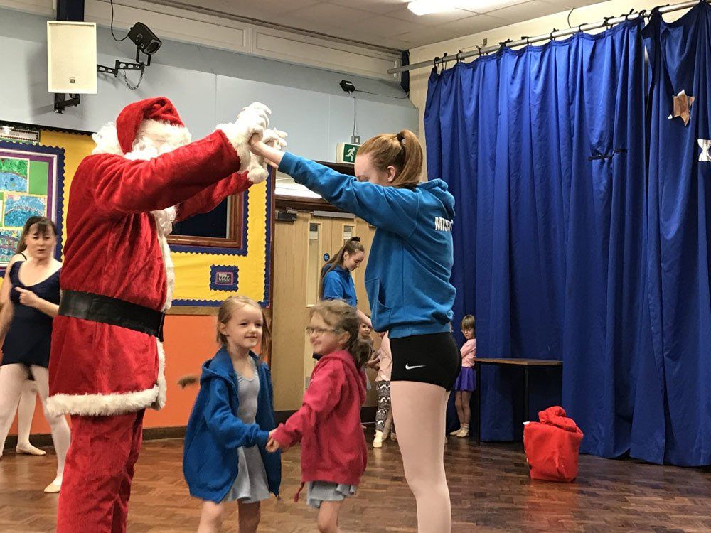 ballet students with Santa