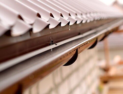 Gutter Drainage — Gutter Repairs in Cherry Hill,, NJ A home in Voorhees, NJ, in need of rain gutter system repairs