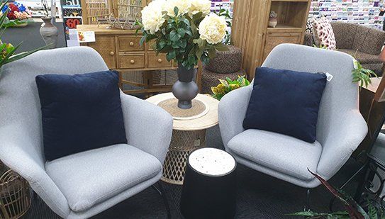 Two Grey Armchairs With Decorative Cushions — Homewares in Alice Springs, NT Two Grey Armchairs With Decorative Cushions — Homewares in Alice Springs, NT