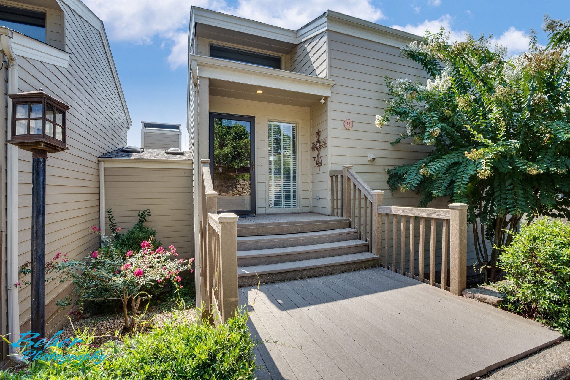 A house with stairs leading up to the front door
