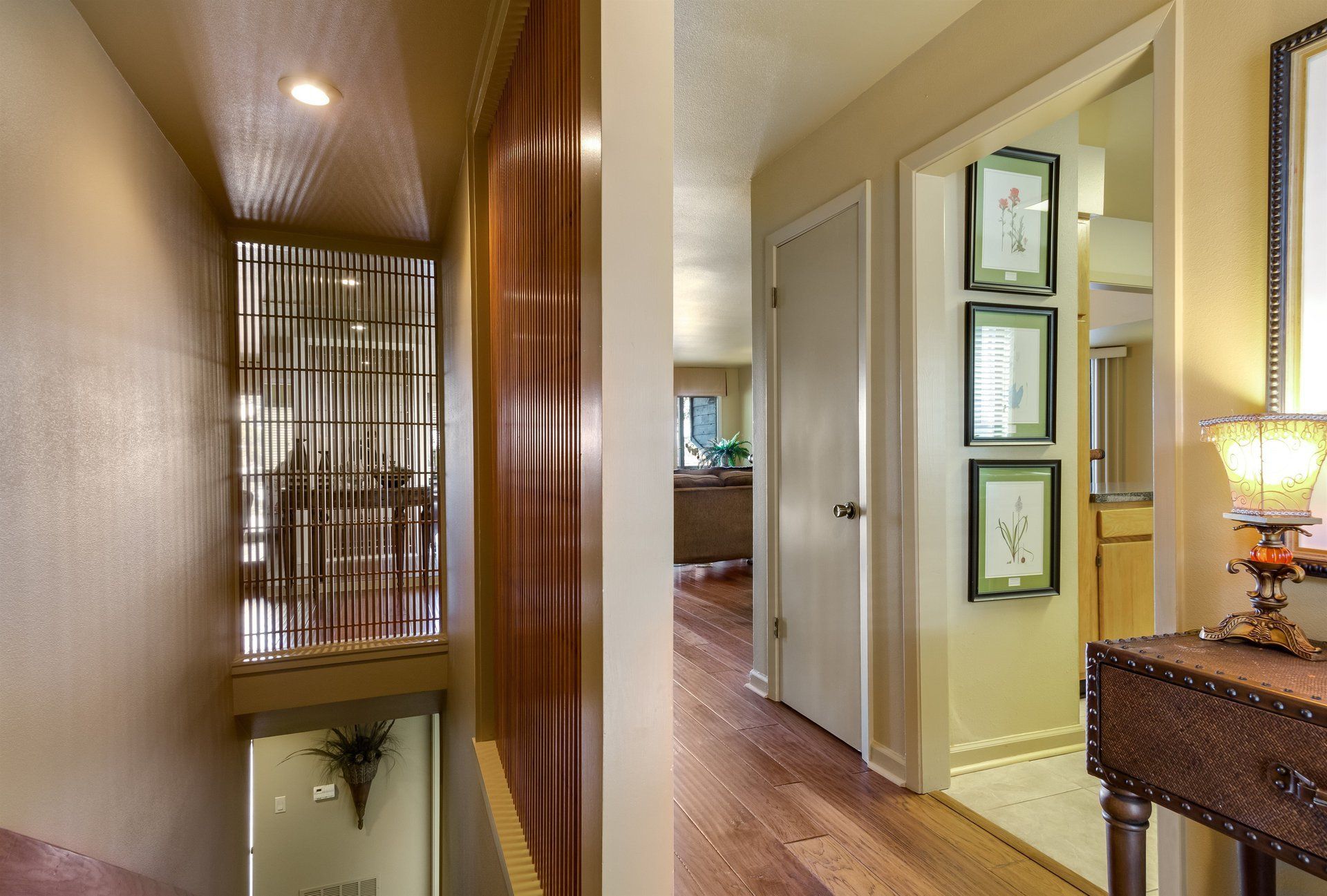 A hallway in a house with a table in the middle