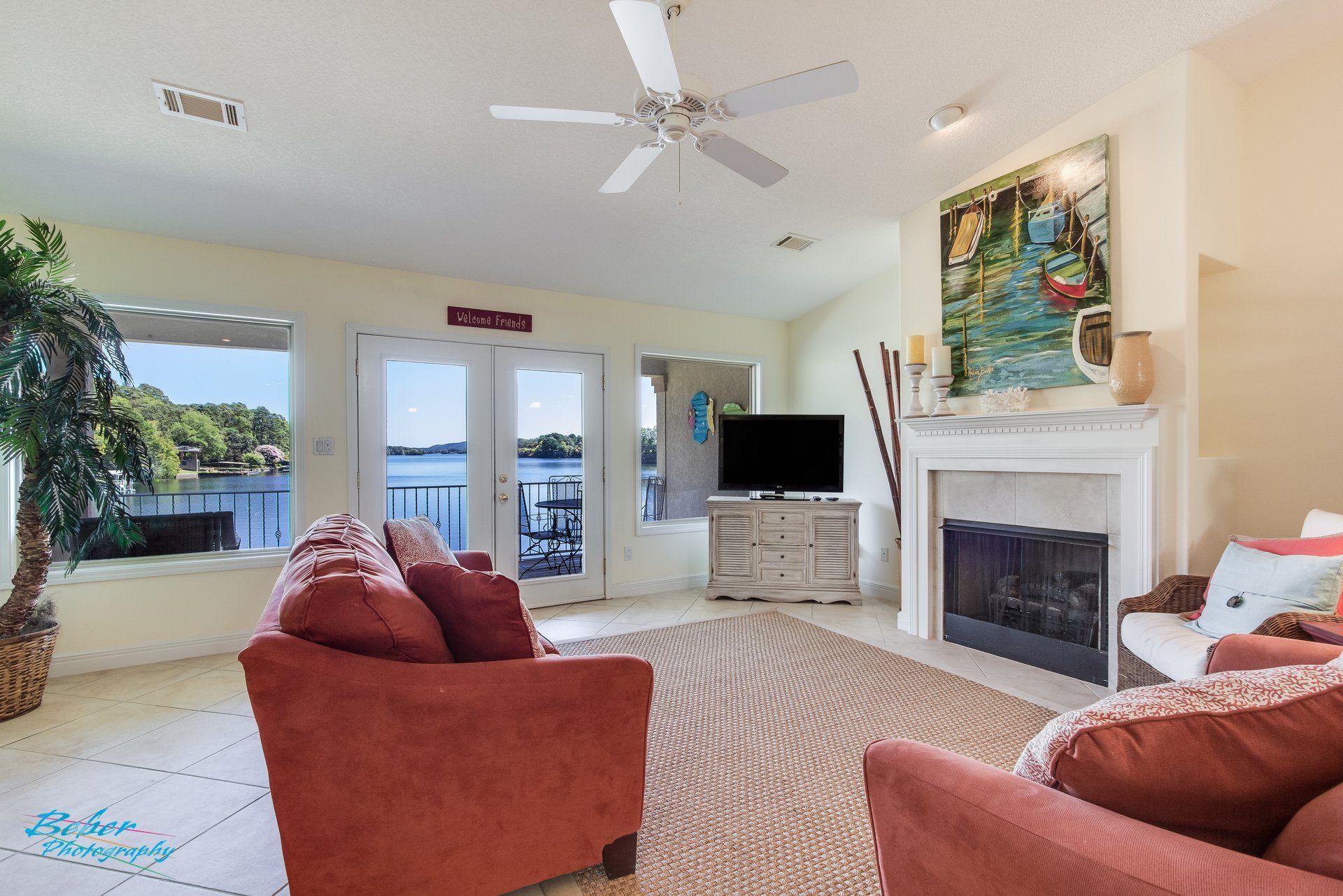 A living room with a fireplace and a television