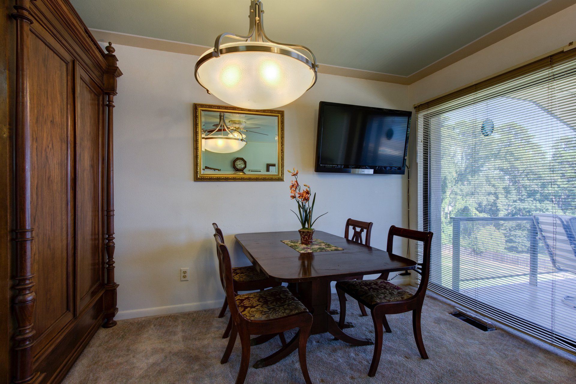 Dining area with entry to deck at Willow Beach B9