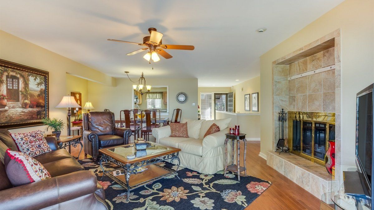 A living room filled with furniture and a fireplace.