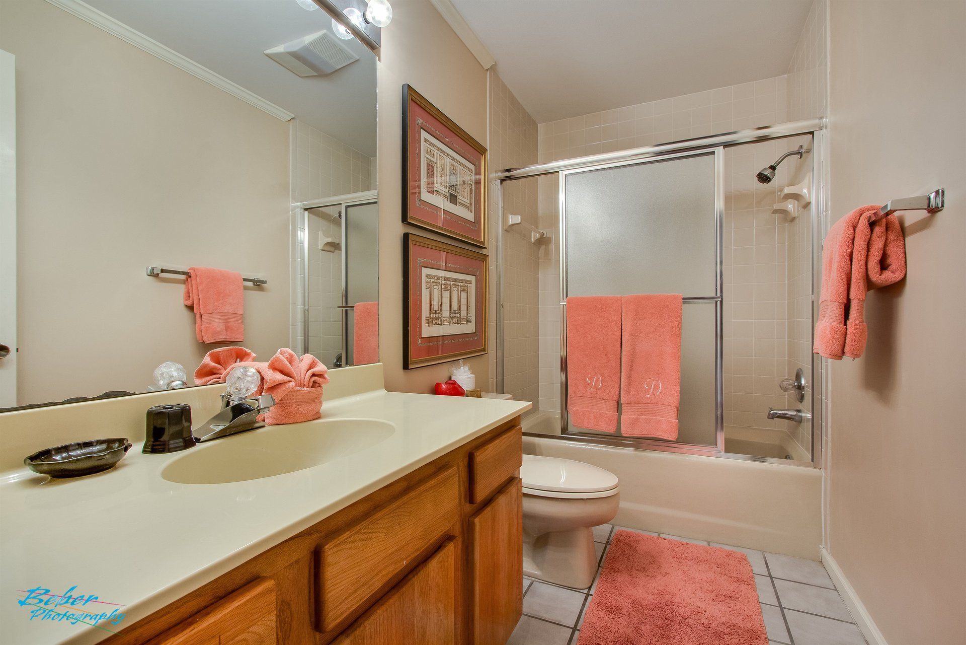 A bathroom with a sink , toilet , and shower.