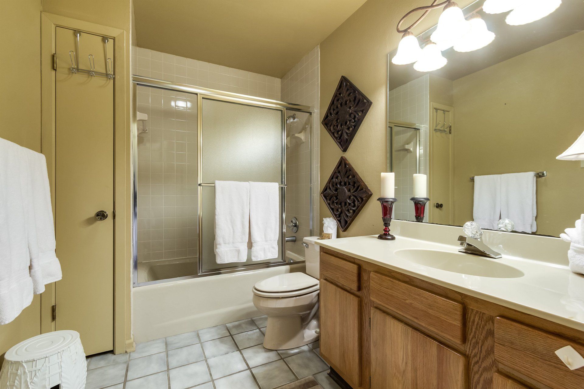 A bathroom with a toilet , sink , and shower.