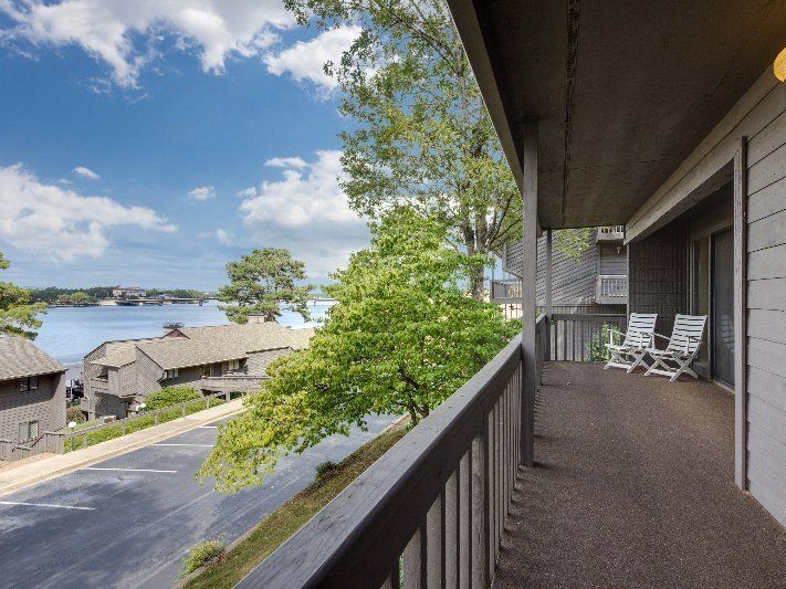 A balcony with a view of a body of water