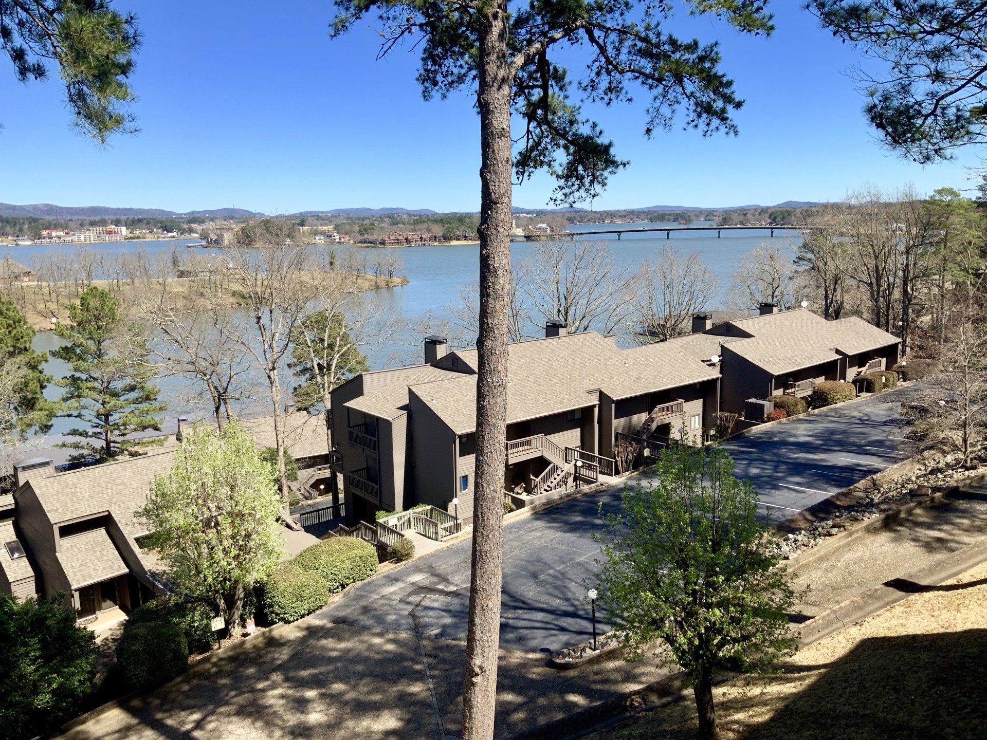 A row of houses with a lake in the background
