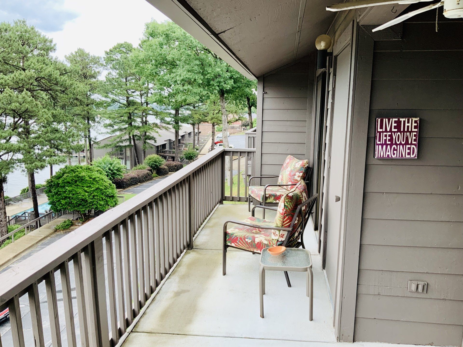 A balcony with a sign that says `` live the life you 've imagined ''