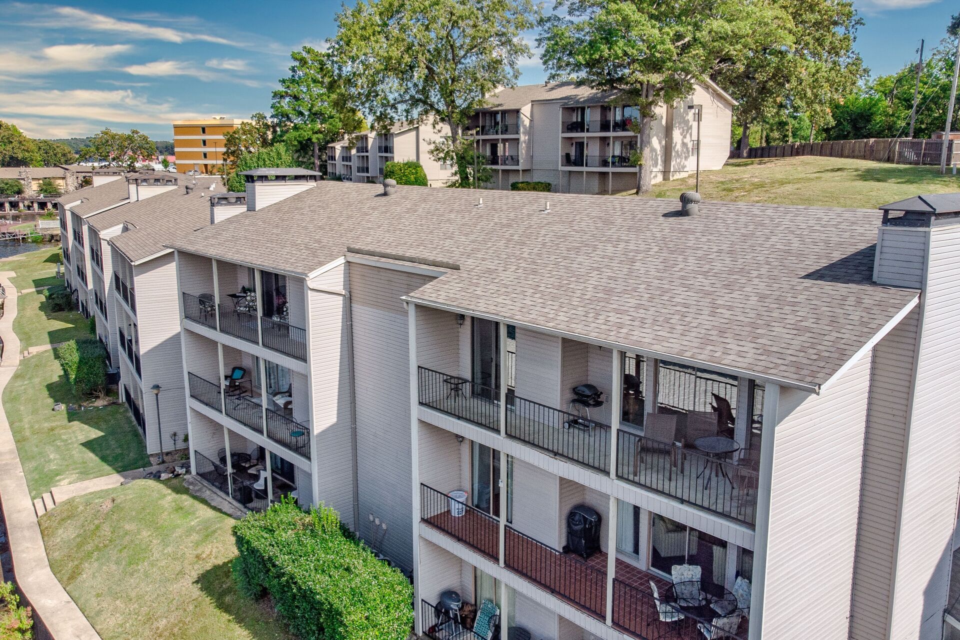 An aerial view of a large apartment building with balconies.