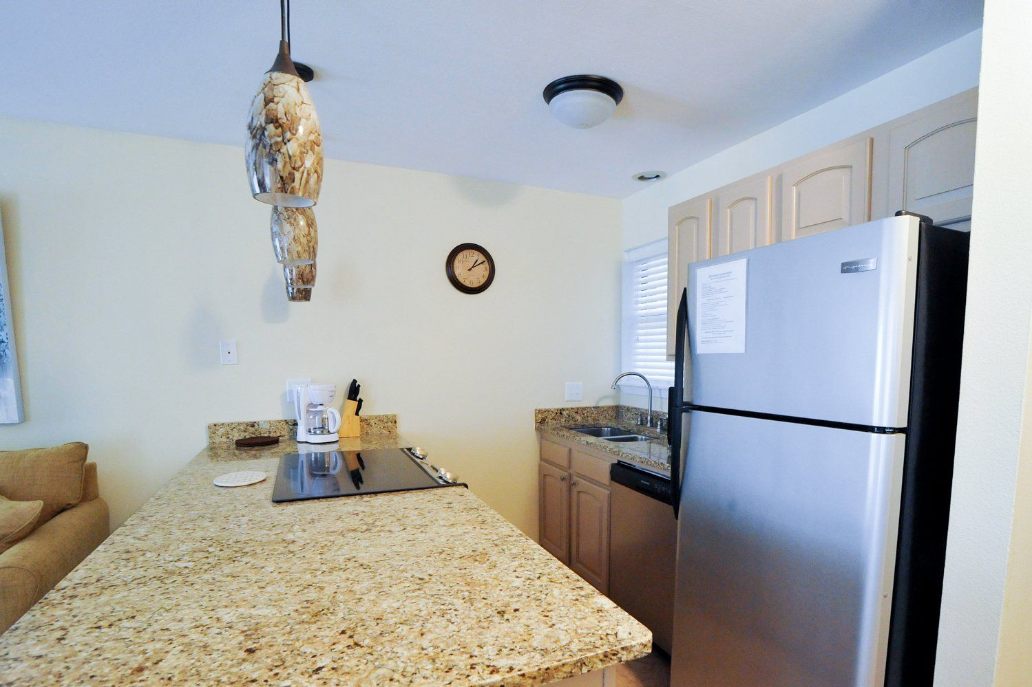 Kitchen bar and fridge at Willow Beach B1
