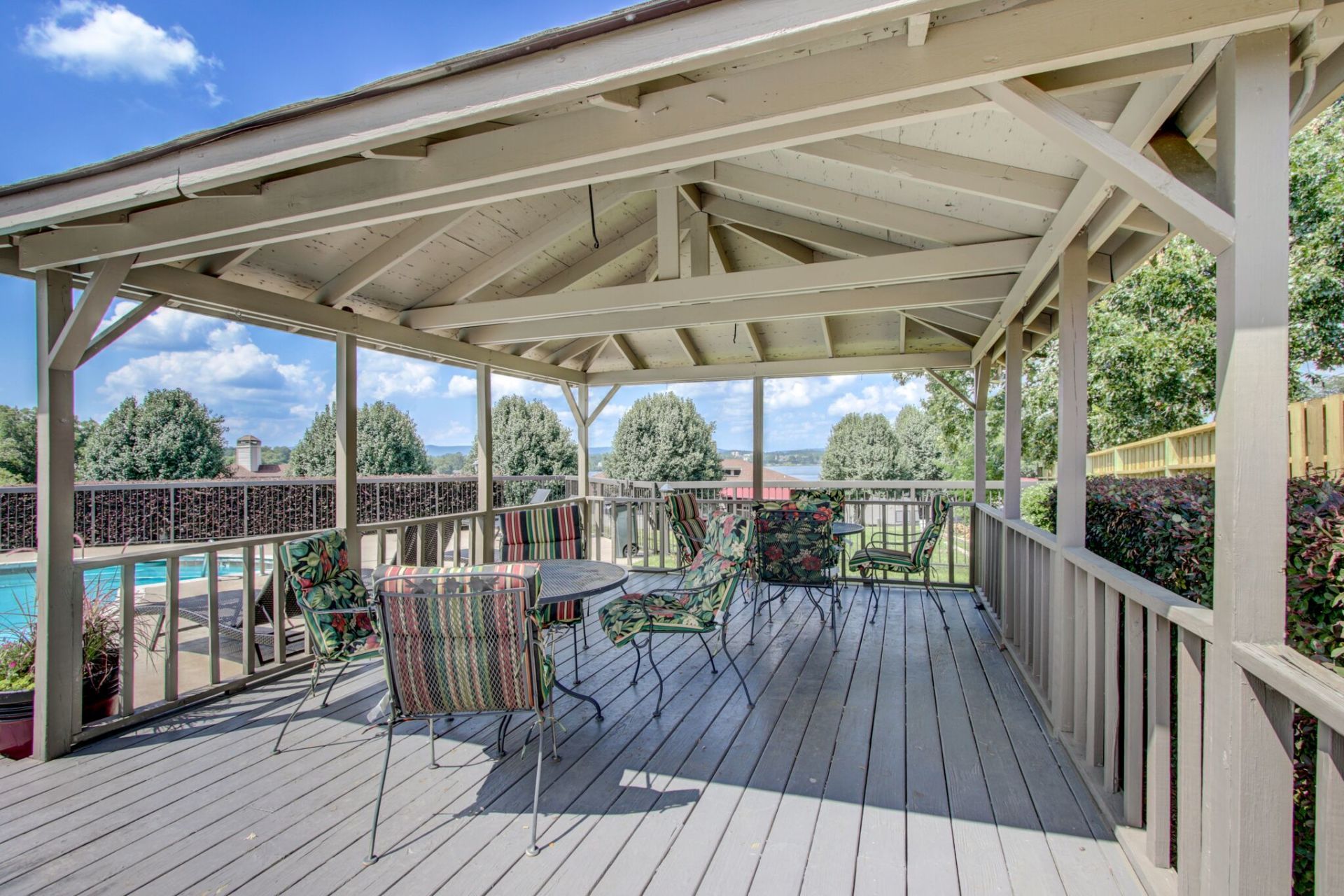 There is a gazebo with a table and chairs on it.