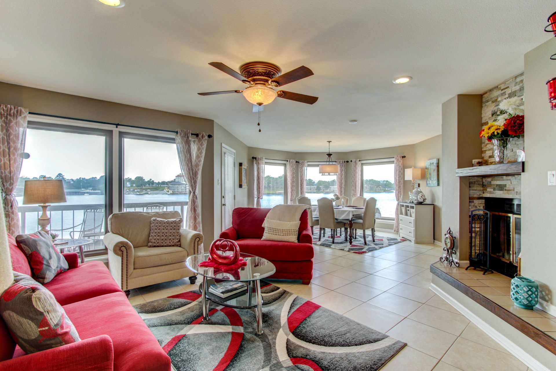 A living room filled with furniture and a ceiling fan.