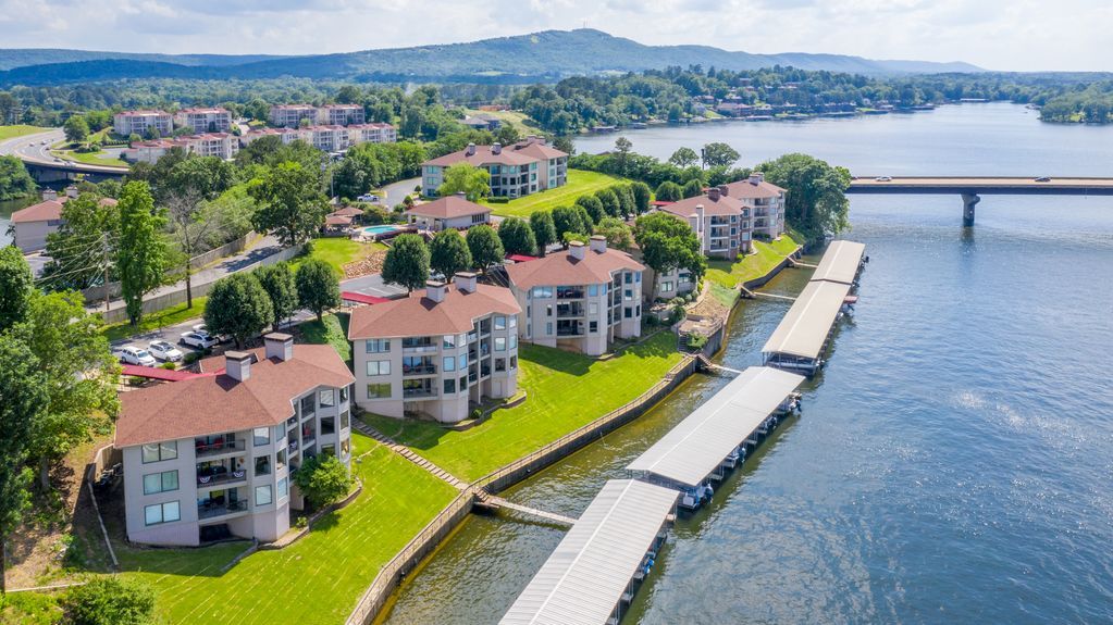 An aerial view of a residential area next to a body of water.