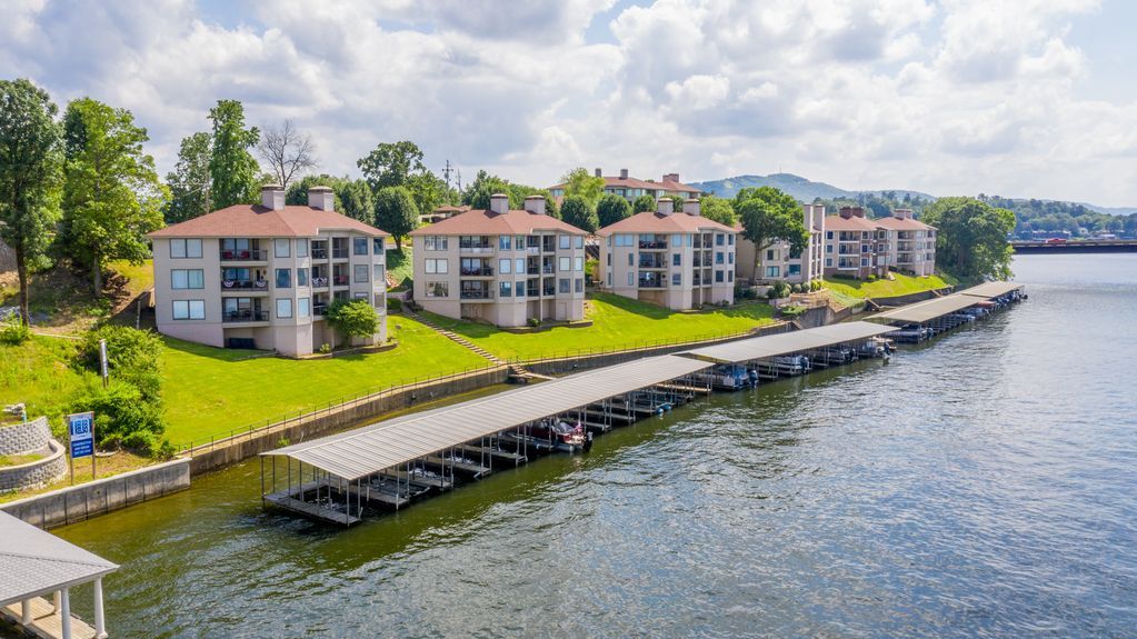 An aerial view of a row of buildings next to a body of water.