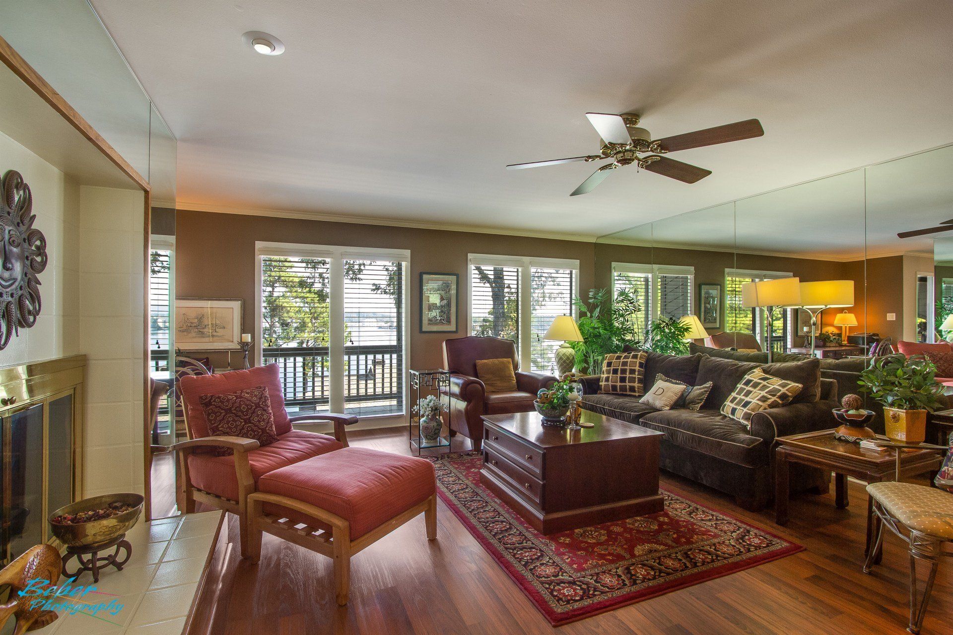 A living room filled with furniture and a ceiling fan