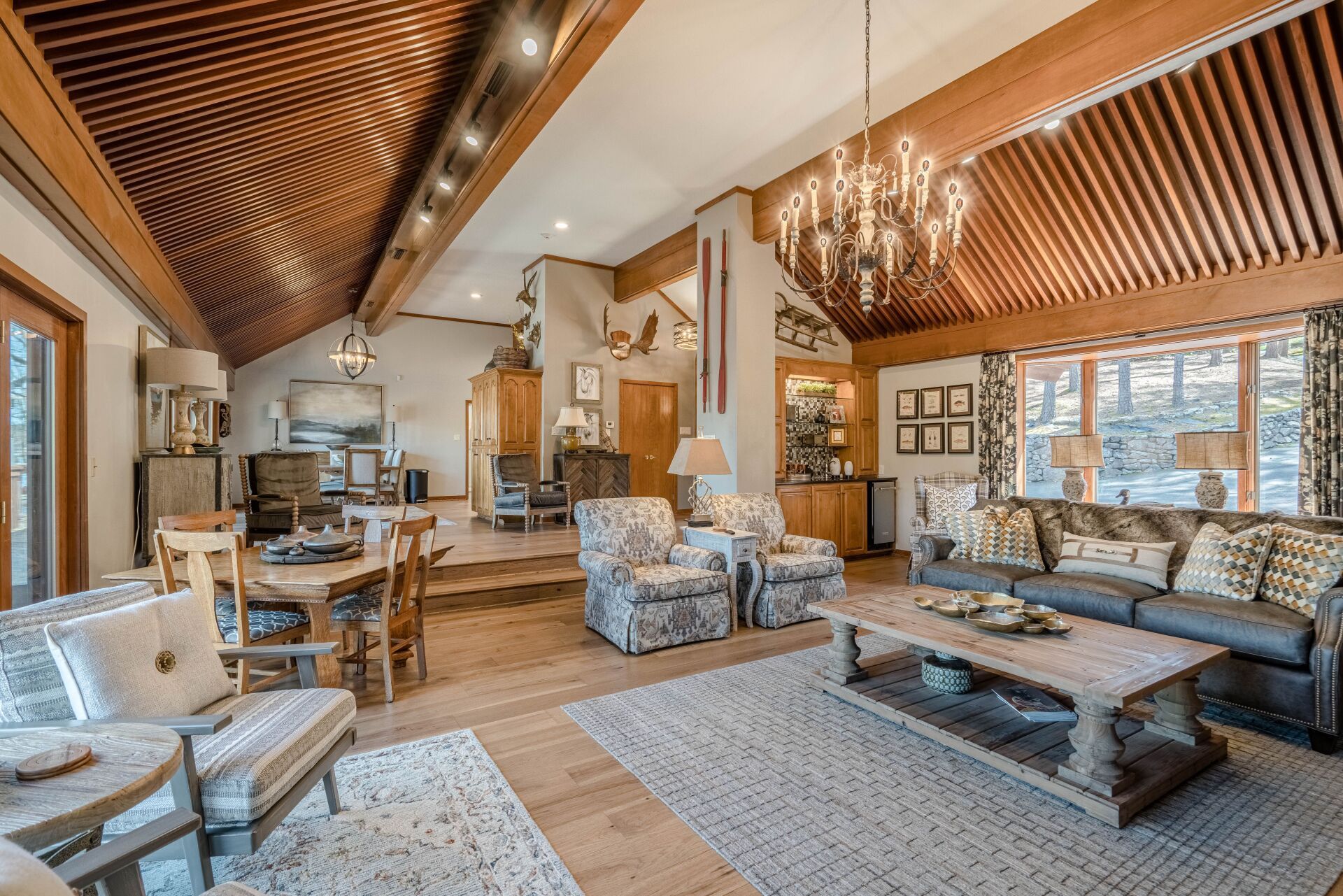 A living room filled with furniture and a chandelier.