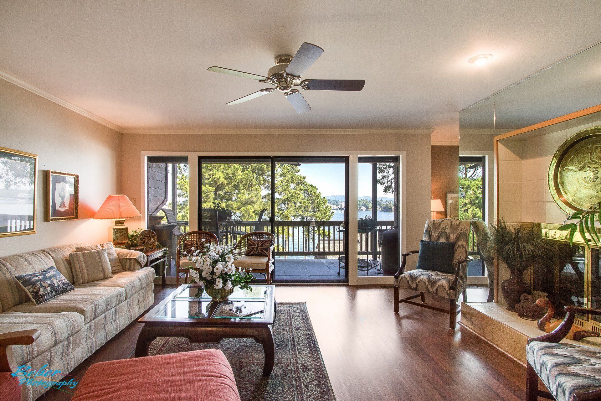 A living room filled with furniture and a ceiling fan