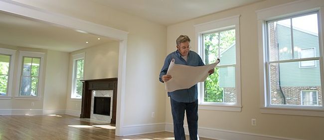 Contractor Checking Blueprints - Home Remodeling in Northern Onondaga County, NY