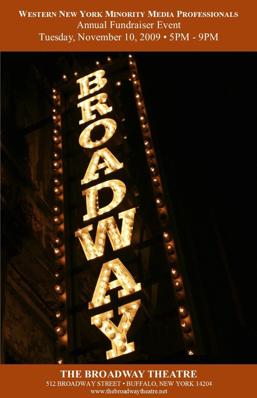 A sign for the broadway theatre is lit up at night