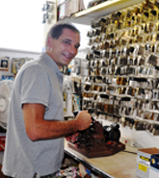 Workman making duplicates of keys - Lock Shop & Key Service in Morrisville, PA Workman making duplicates of keys - Lock Shop & Key Service in Morrisville, PA
