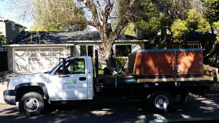 Bay Junk truck in front of residence