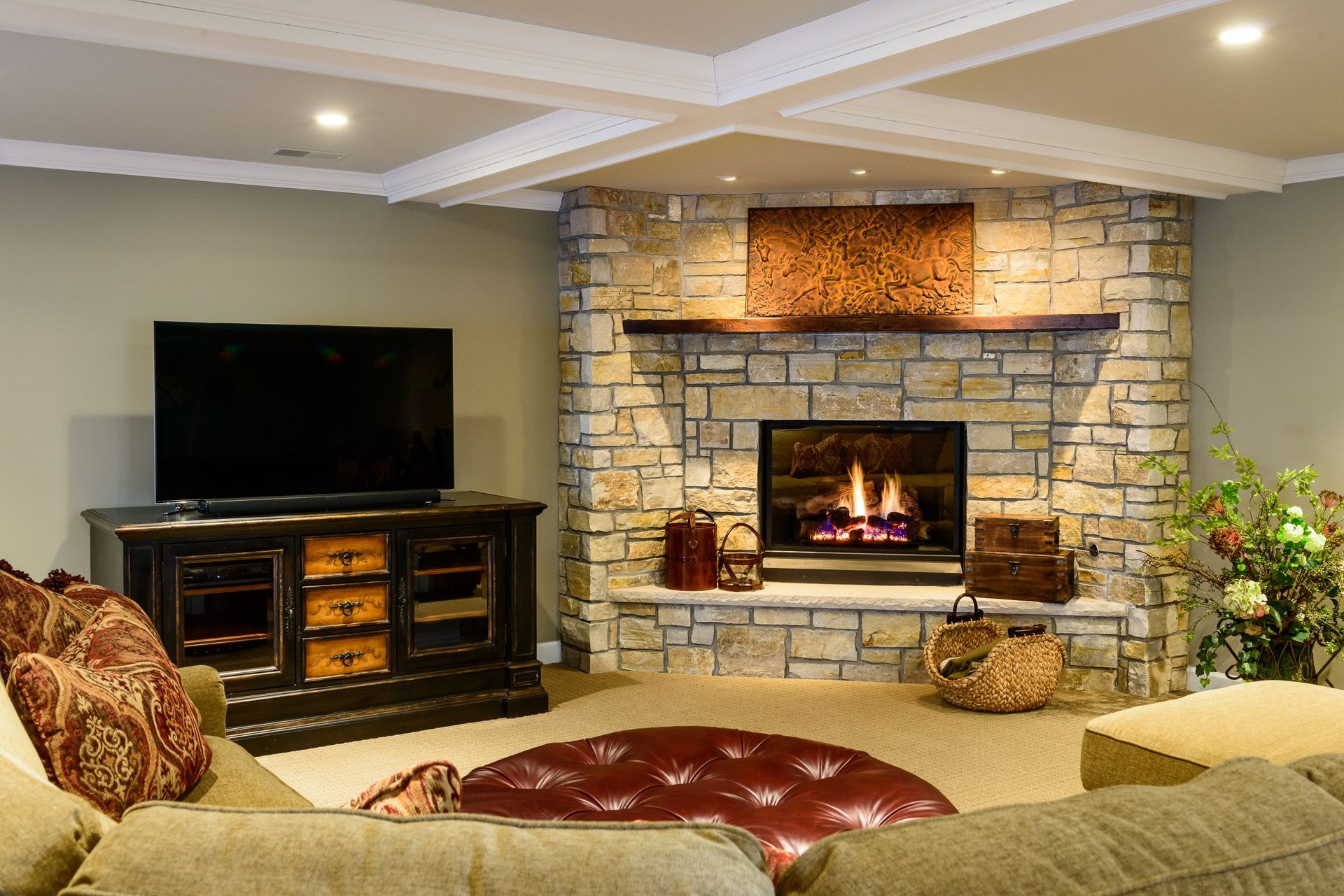 A living room with a fireplace and a flat screen tv.