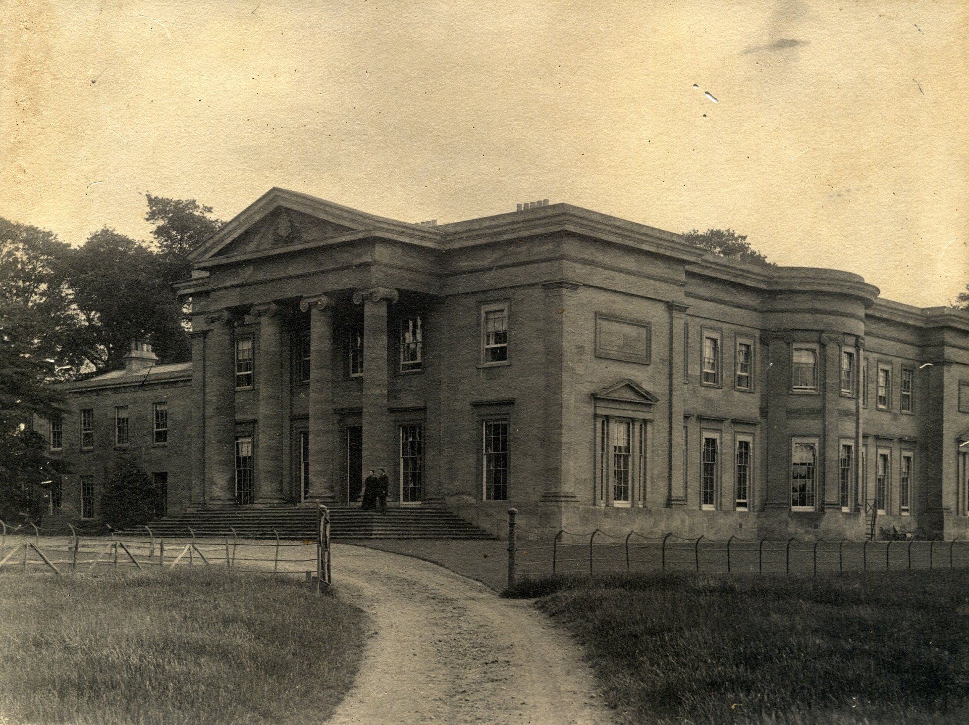 An old black and white photo of a large building