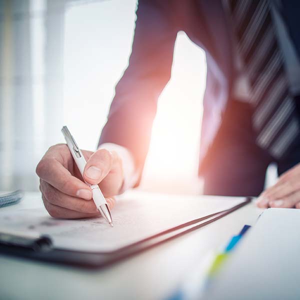 Personal Loans — Business Man Signing Contract in Humble, TX