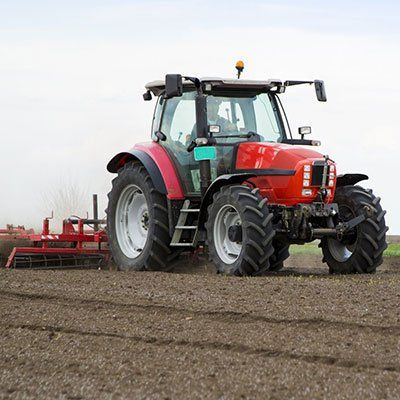 Alternator Repair — Farmer in Tractor in Salinas, CA