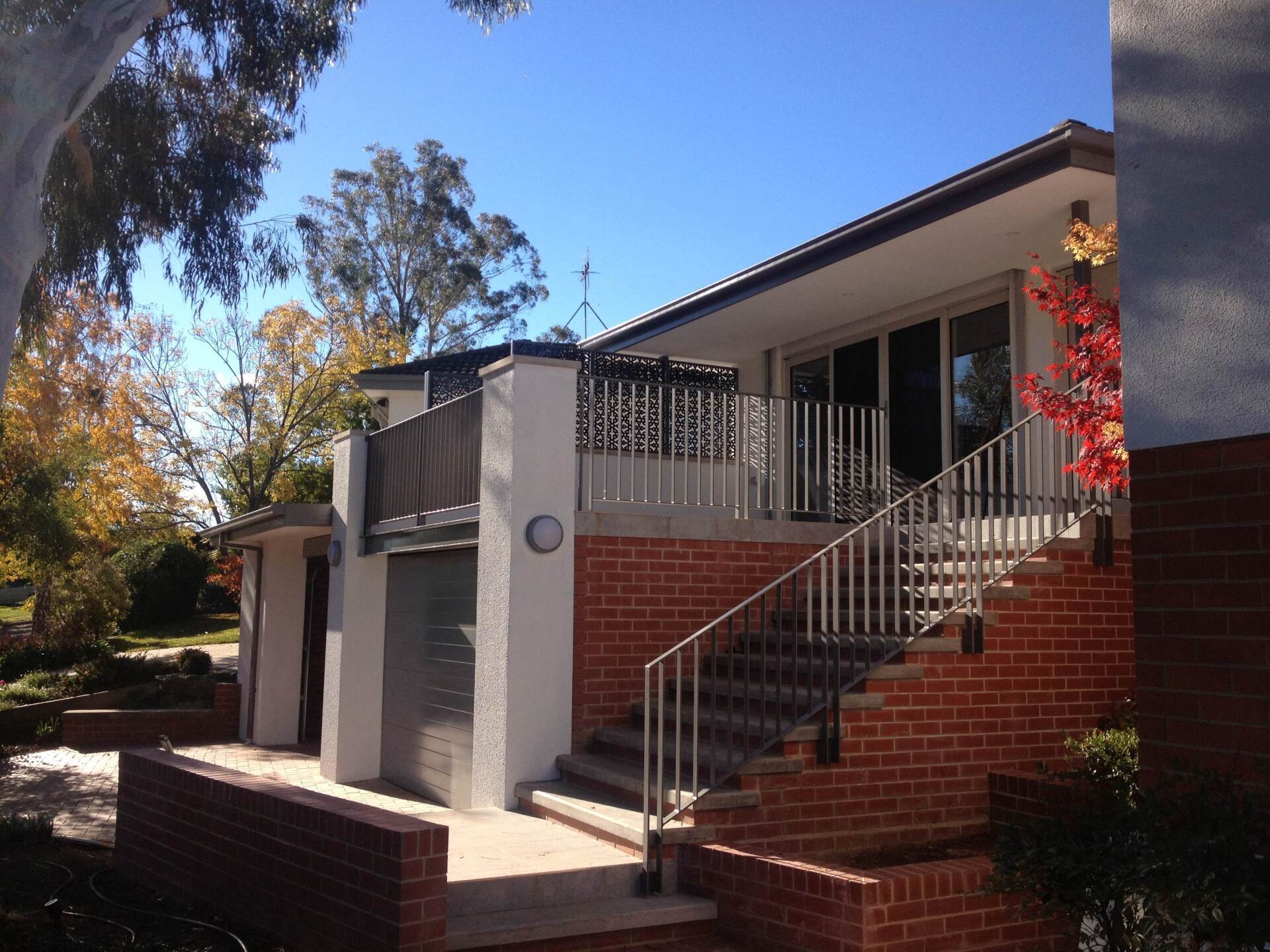 A brick house with stairs leading up to it