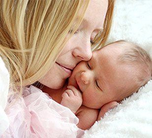 Happy mother with newborn baby — The Law Office of Kelly Mulligan in Bel Air, MD Happy mother with newborn baby — The Law Office of Kelly Mulligan in Bel Air, MD