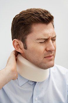 Man wearing neck braces — The Law Office of Kelly Mulligan in Bel Air, MD Man wearing neck braces — The Law Office of Kelly Mulligan in Bel Air, MD