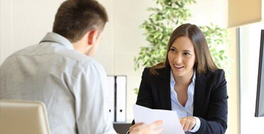 Female Assistance Talking with a Client — Legal Document Preparation in Bakersfield, CA Female Assistance Talking with a Client — Legal Document Preparation in Bakersfield, CA