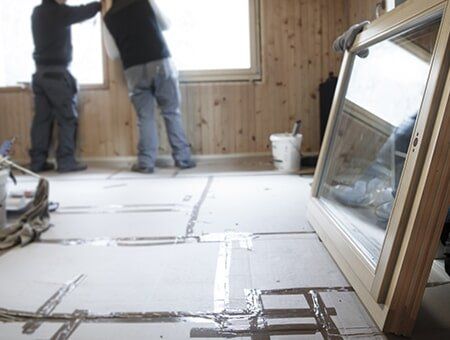 Workers Installing New Windows — Remodeling Contractor in Denver, CO Workers Installing New Windows — Remodeling Contractor in Denver, CO