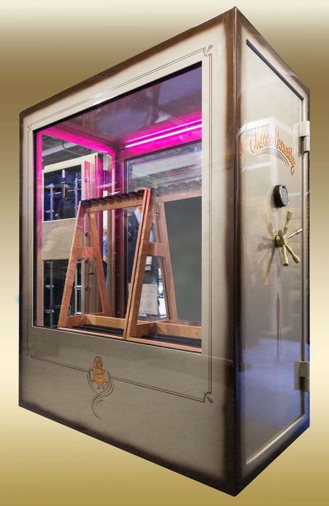 Glass display case with pink-lit interior and wooden A-frame stands inside a shop window