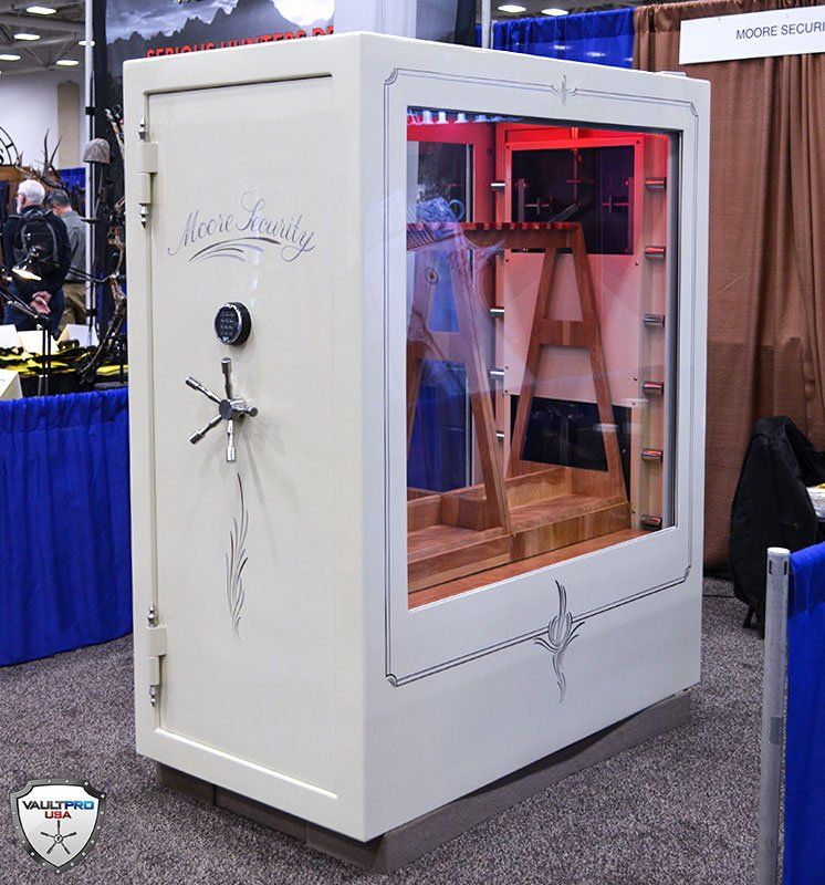 White full-length mirrored cabinet with red interior lighting at a trade show booth.