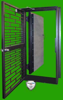 Black metal security gate with a gray door panel, shown open on a bright green background