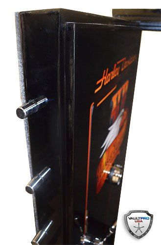 Black metal cabinet or safe with two protruding silver bolts and a Halloween-themed sign on the door