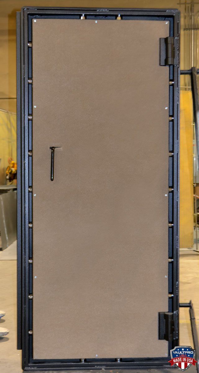 large vault door with black on black finish and black chrome hardware, made in USA