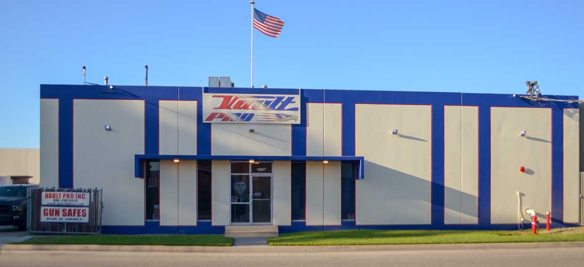 Blue and beige building with U.S. flag and U-Haul sign, seen from the street