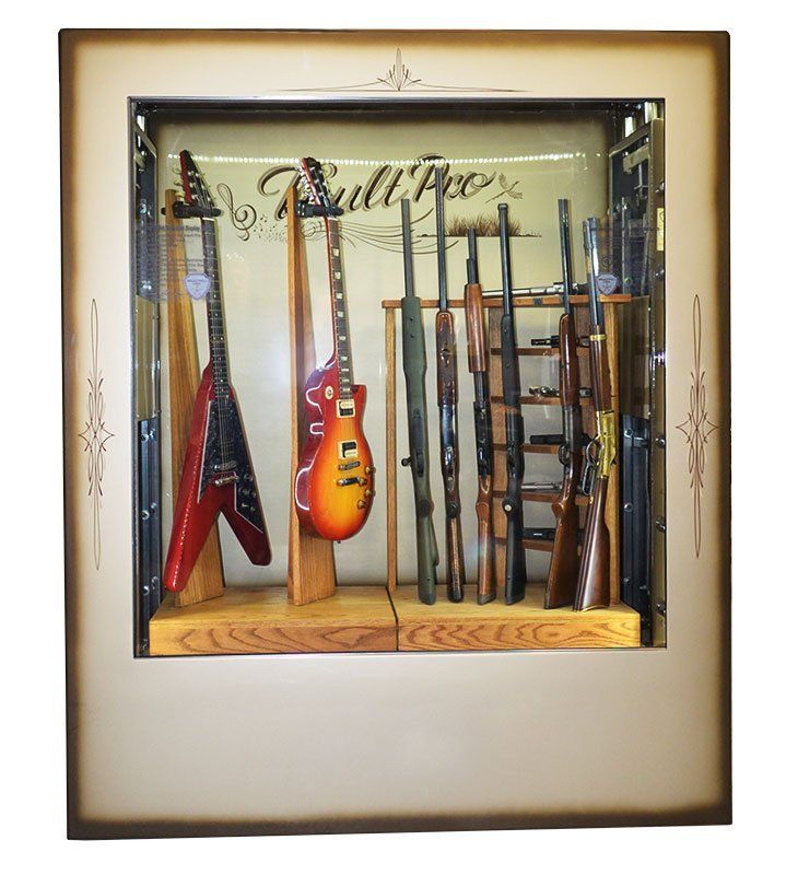 Framed wall art with assorted guitars and instruments displayed behind glass