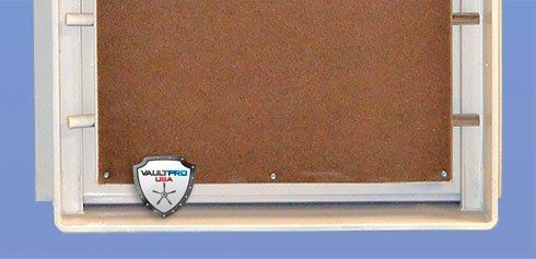 Small cork bulletin board in a light wood frame with a shield logo at the bottom
