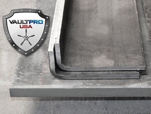 Vault Pro USA shield logo on a gray metal vault door or safe opening.