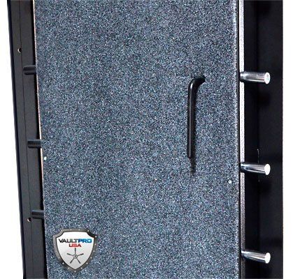 Close-up of a gray textured metal safe door with handle and three locking bolts.